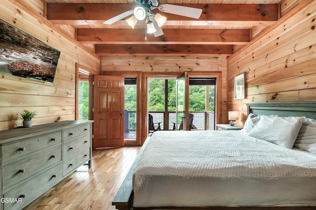 bedroom featuring beam ceiling, access to outside, and wooden ceiling