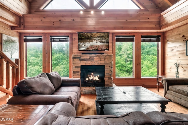 living room with hardwood / wood-style flooring and wood walls