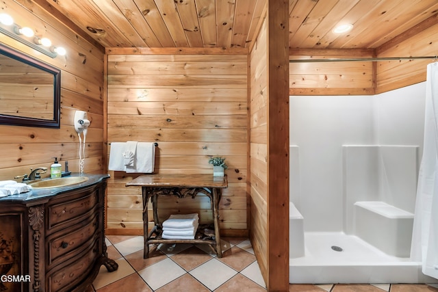 bathroom featuring wood walls, vanity, curtained shower, and wood ceiling