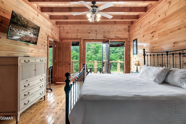 bedroom featuring wood walls, access to exterior, light wood-type flooring, beam ceiling, and wood ceiling