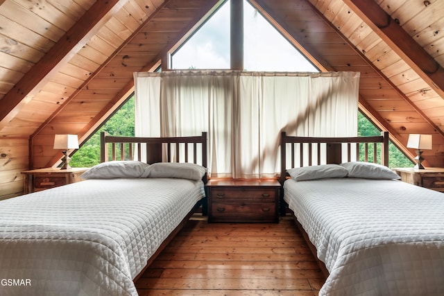 bedroom with vaulted ceiling with beams, wood walls, wood ceiling, and multiple windows