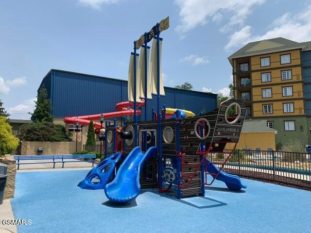 communal playground featuring fence