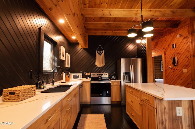 1317 Old Knoxville Hwy, Sevierville, TN 37876 - kitchen with stainless steel appliances, a sink, a ceiling fan, dark wood finished floors, and wood walls