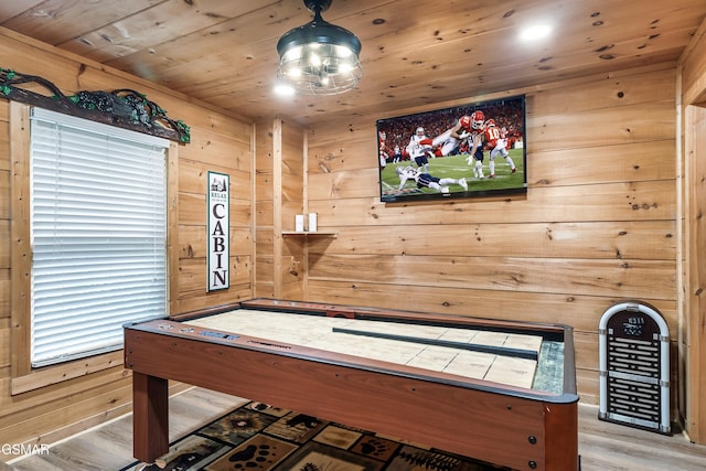 game room featuring wooden walls and wood ceiling