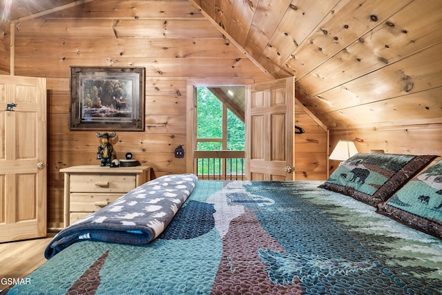 bedroom with access to outside, wood walls, wood finished floors, and lofted ceiling