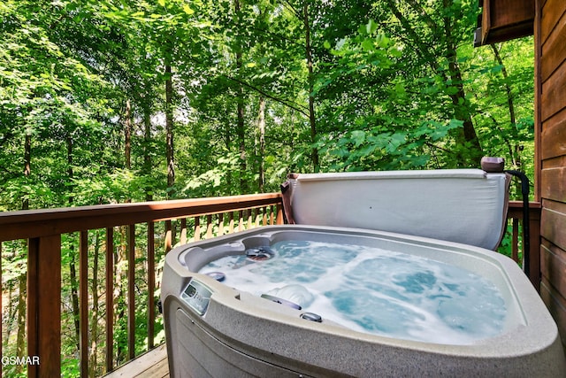 deck featuring a hot tub