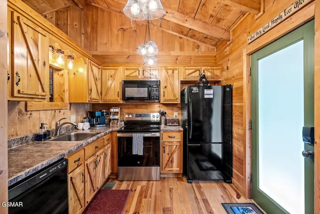 3110 Cove Creek Way, Sevierville, TN 37862 - kitchen with black appliances, light wood finished floors, wood walls, wood ceiling, and dark countertops