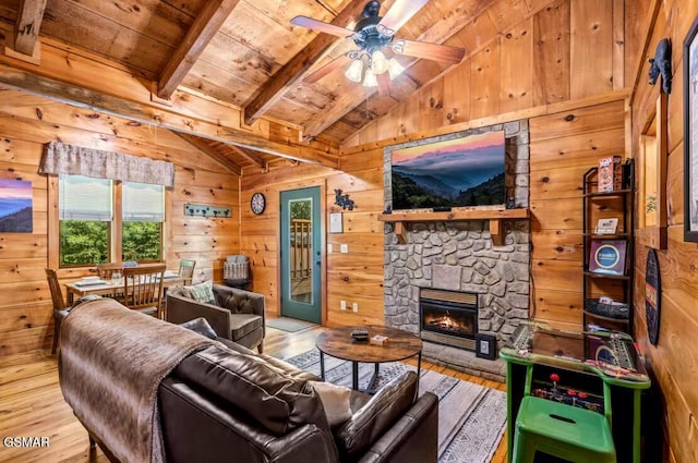 3110 Cove Creek Way, Sevierville, TN 37862 - living room featuring hardwood / wood-style flooring, wood ceiling, wood walls, ceiling fan, and a stone fireplace
