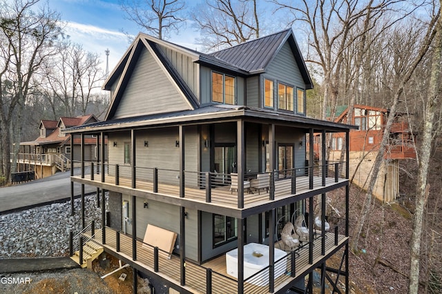 rear view of house featuring a balcony