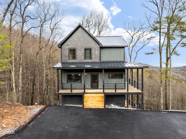 view of front of property featuring a garage and covered porch