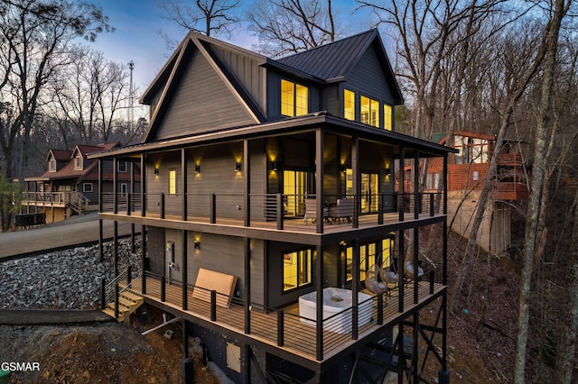 rear view of property with a balcony