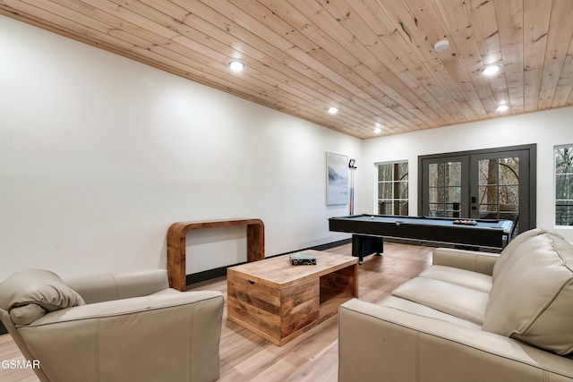 game room featuring light hardwood / wood-style floors, pool table, wooden ceiling, and french doors