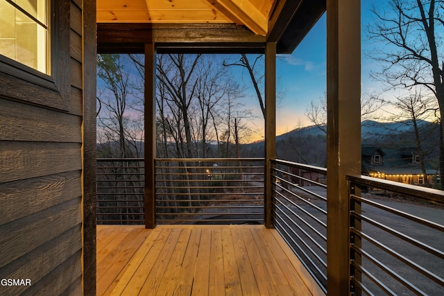 deck at dusk with a mountain view