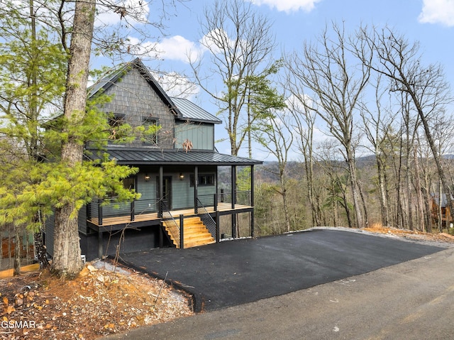 view of front of property featuring a garage and a porch