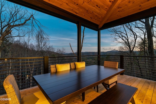 deck at dusk with a gazebo and a mountain view