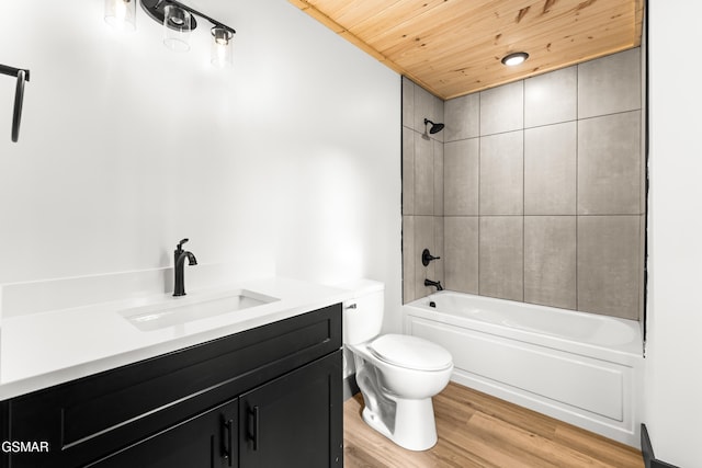 full bathroom featuring shower / washtub combination, wood-type flooring, vanity, toilet, and wooden ceiling