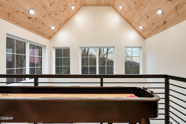 rec room featuring high vaulted ceiling and wood ceiling