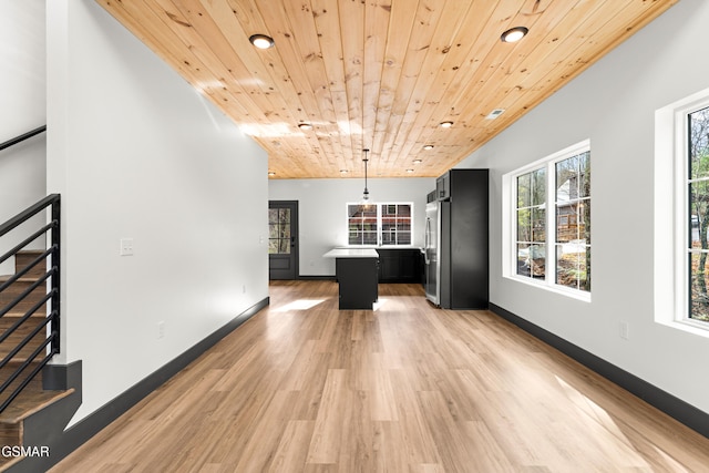 interior space with light wood-type flooring and wooden ceiling