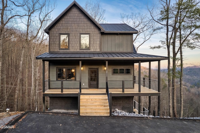 view of front of house featuring a garage and a porch