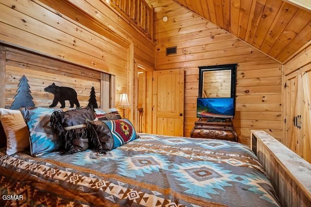 bedroom with vaulted ceiling, wooden walls, and wooden ceiling