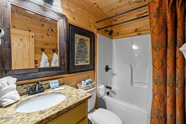 bathroom featuring wooden walls, toilet, wooden ceiling, shower / bathtub combination, and vanity