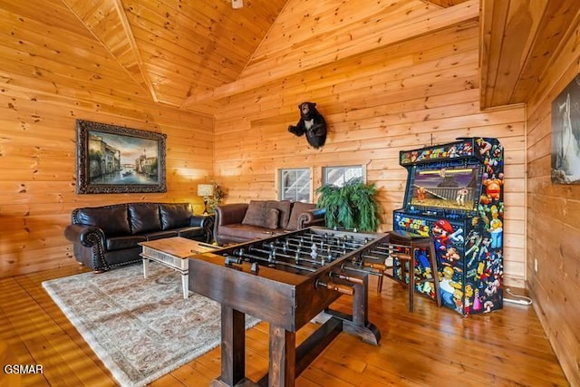 recreation room featuring hardwood / wood-style flooring, wooden walls, and wooden ceiling