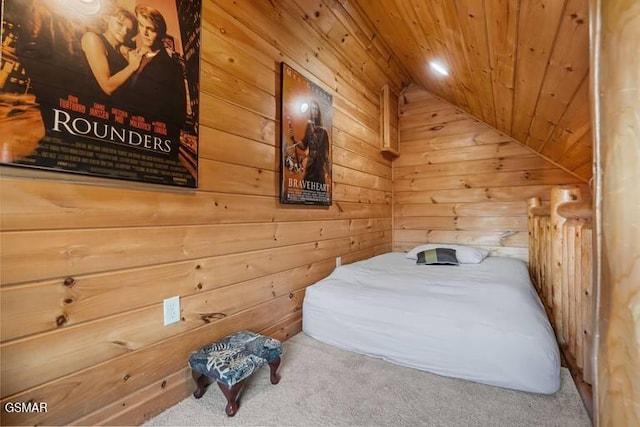 carpeted bedroom featuring lofted ceiling, wooden walls, and wood ceiling