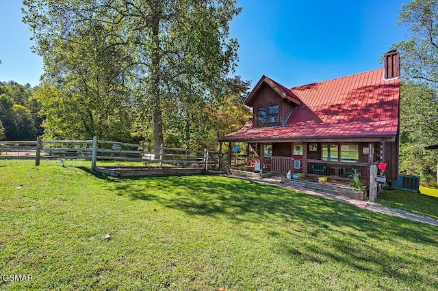 view of yard featuring central air condition unit and a porch