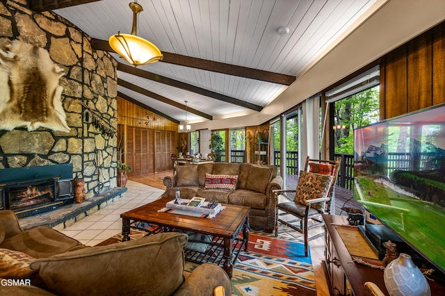 1923 E Arolla Ct, Gatlinburg, TN 37738 - living room featuring plenty of natural light, tile patterned floors, a fireplace, and wooden walls