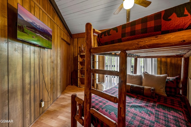 1923 E Arolla Ct, Gatlinburg, TN 37738 - bedroom with wooden walls and light wood-style flooring