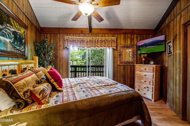 1923 E Arolla Ct, Gatlinburg, TN 37738 - bedroom featuring access to outside, wood walls, light wood-style floors, and a ceiling fan