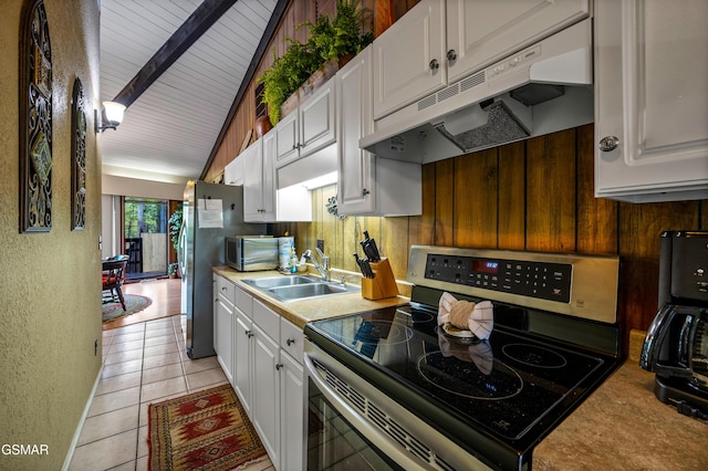 1923 E Arolla Ct, Gatlinburg, TN 37738 - kitchen featuring stainless steel appliances, under cabinet range hood, white cabinetry, a textured wall, and light tile patterned floors