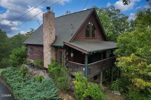 rear view of house with a porch