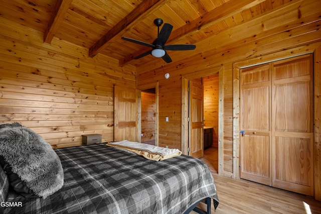 bedroom featuring wood ceiling, wood walls, ceiling fan, light wood-type flooring, and beamed ceiling