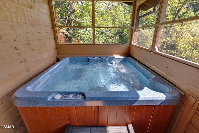 view of pool with an indoor hot tub