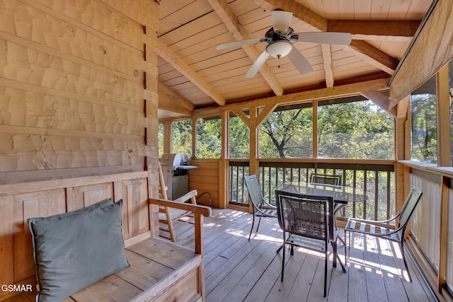 exterior space with grilling area, outdoor dining area, and ceiling fan