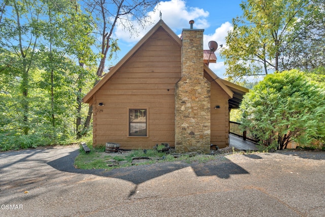 view of side of property featuring a chimney