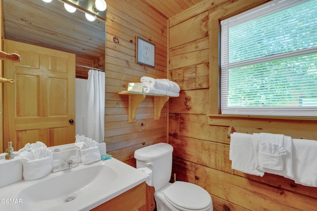 full bathroom featuring wood ceiling, wooden walls, toilet, and vanity