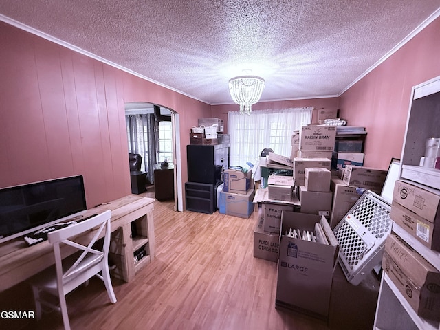 office area with crown molding, light hardwood / wood-style flooring, a textured ceiling, and a chandelier