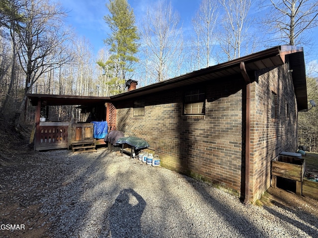 view of side of home with a patio