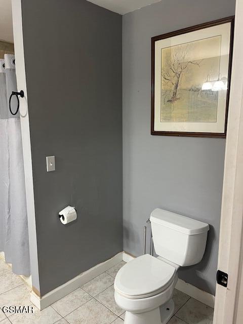 bathroom featuring tile patterned floors and toilet