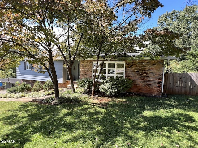 view of side of property featuring a yard