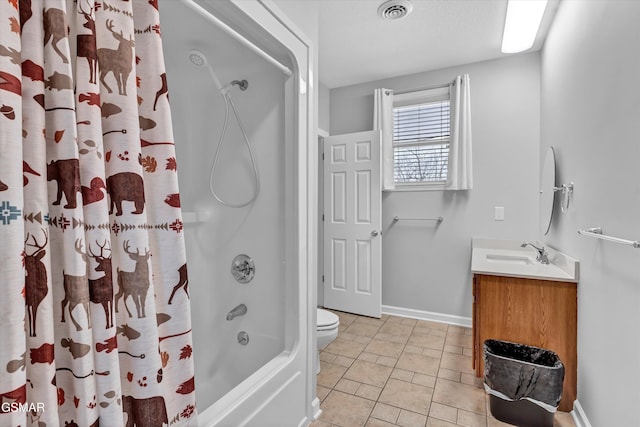 full bathroom featuring vanity, toilet, tile patterned flooring, and shower / tub combo