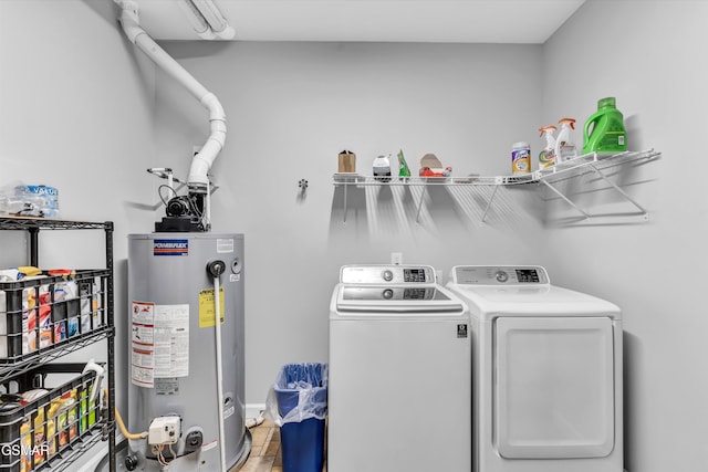 laundry area featuring separate washer and dryer and water heater