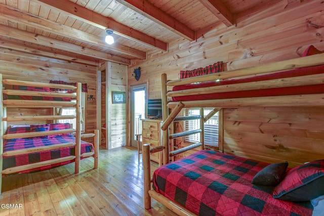 1707 Ridgecrest Dr, Sevierville, TN 37876 - bedroom with wooden ceiling with exposed beams, wooden walls, and wood-type flooring