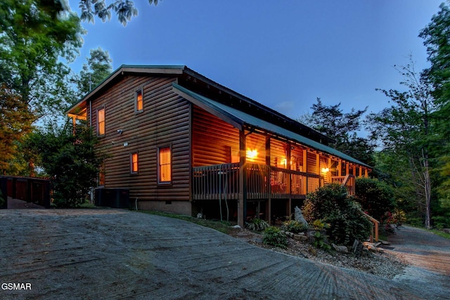 1707 Ridgecrest Dr, Sevierville, TN 37876 - view of side of property with faux log siding, crawl space, and a wooden deck