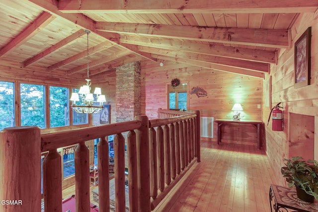 1707 Ridgecrest Dr, Sevierville, TN 37876 - corridor featuring a chandelier, wooden walls, wood ceiling, an upstairs landing, and light wood finished floors