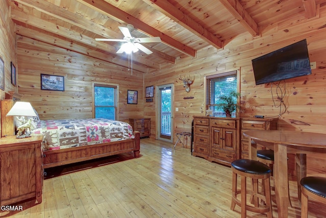 1707 Ridgecrest Dr, Sevierville, TN 37876 - bedroom with wooden ceiling with exposed beams, wood walls, light wood-style floors, and access to outside