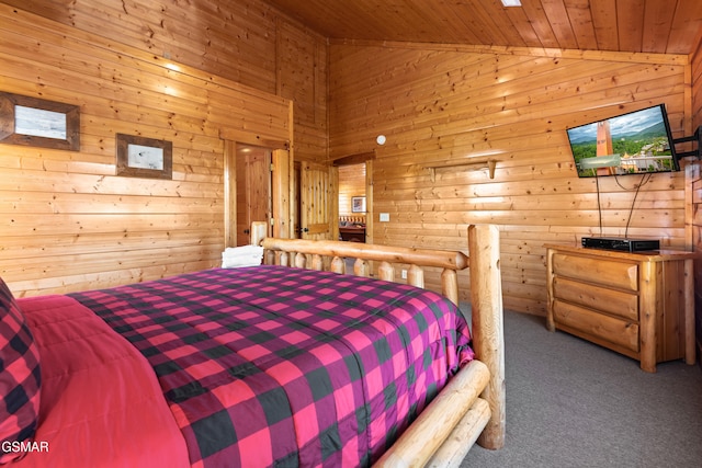 bedroom with wooden ceiling, carpet flooring, wooden walls, and high vaulted ceiling