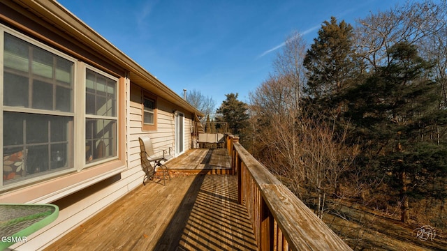 wooden balcony featuring a deck